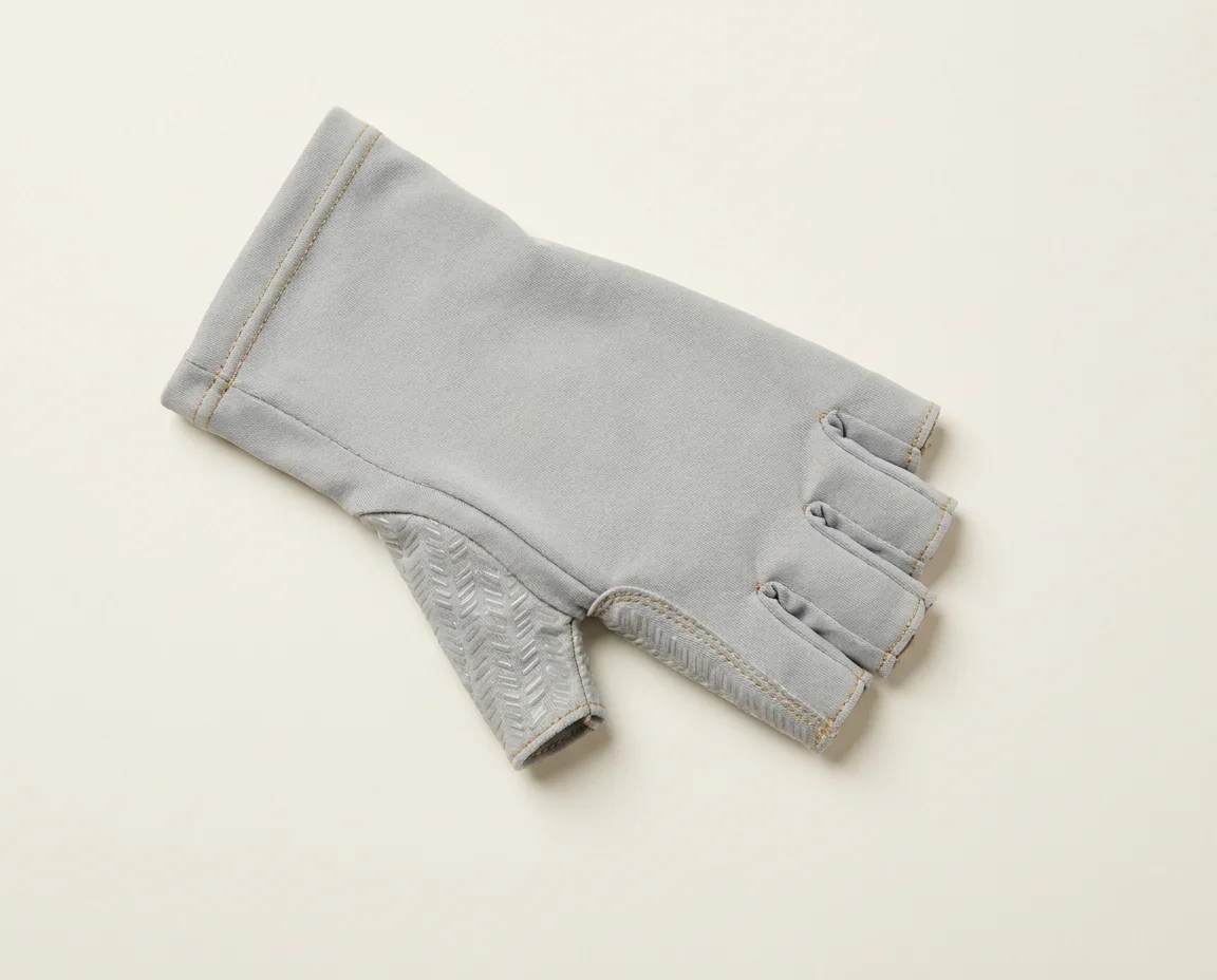Fingerless UPF fishing glove covering the back of the hand